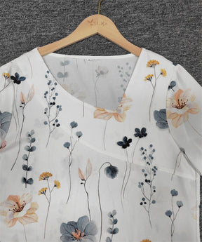 FallStil® - Fris witte, kleurrijke mini-jurk met V-hals en bloemenprint