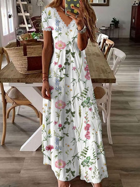 SpringStil® - Witte maxi zomerjurk met V-hals en tuinprint